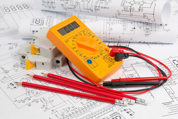 electrical engineering drawings, circuit breaker, pencils and digital multimeter