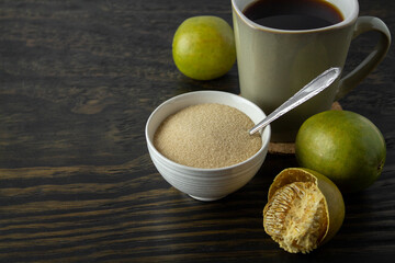 dried monk fruit, luo han guo, and monk fruit sugar crystals accompanied with a cup of tea or coffee