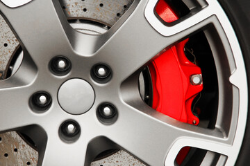 Fototapeta na wymiar Car wheel. Brake discs. Red car caliper. Background. For advertising.