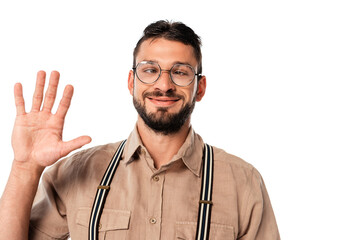 Smiling strabismus nerd in eyeglasses waving hand isolated on white