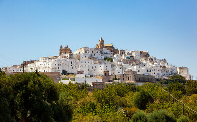 Panoramic view of the white and old city of Ostuni on a hilltop and with the cathedral on top