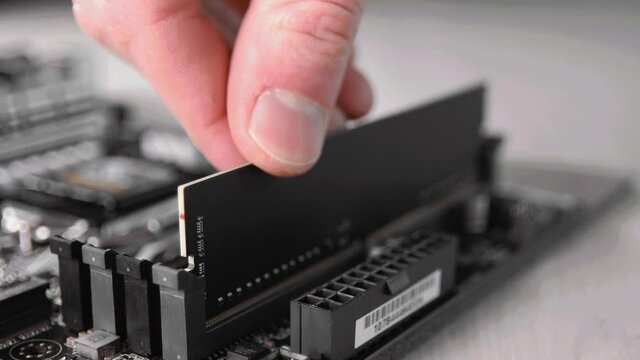 Installing RAM on the computer motherboard. Computer service.Acquisition of a new PC