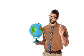 Handsome bearded teacher looking at camera and holding globe with pen isolated on white