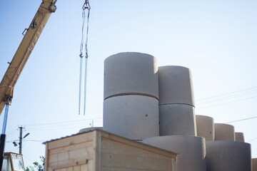 The concrete rings are being prepared for transportation to the construction site.