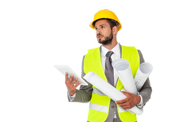 Handsome engineer holding blueprints and digital tablet while looking away isolated on white