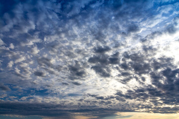 Naklejka na ściany i meble altocumulus cloud at sunset