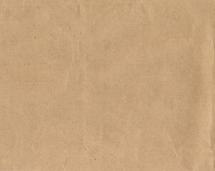 Fototapeta na wymiar Old crumpled craft paper, brown rough paper texture