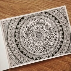 Mandala art on paper in black and white pattern