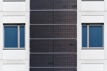 Fototapeta premium Solar panels on the facade of a residential building.