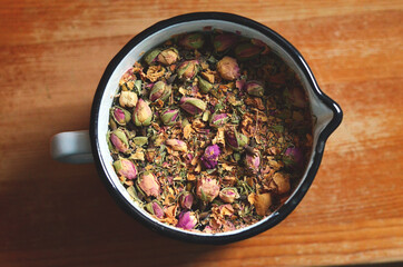 A pot of artisanal rose tea view from above