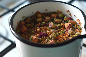 A pot of artisanal rose tea view from the side