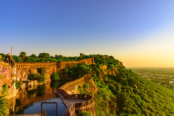 View during sunset from Chittor or Chittorgarh Fort with city in backdrop. It is one of the largest...