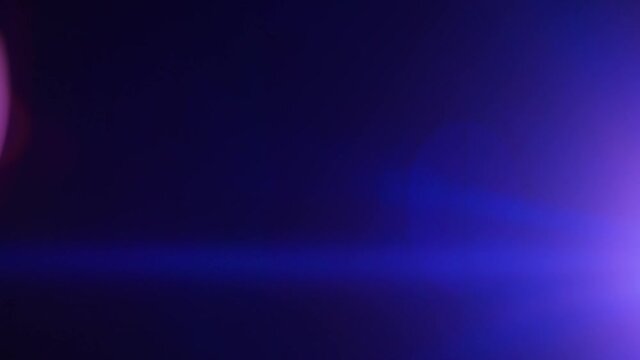 Short blue anamorphic lens flare strobing and moving on the right side of frame