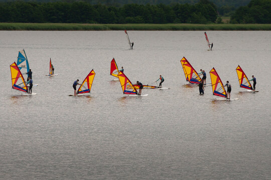 Dzwirzyno, Poland.  July 17, 2020 Unidentified young people at the school of windsurf. The lake is very shallow