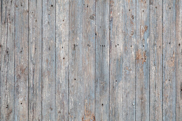 Fototapeta premium Wooden boards on an old fence as an abstract background.