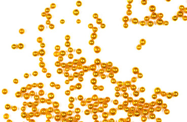 Small balls of gold on a white background.