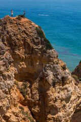 Fototapeta na wymiar Algarve, Lisbon. Beautiful bay near Lagos town with high cliffs on the shore of the Atlantic Ocean. The Algarve is the southernmost region of continental Portugal. 