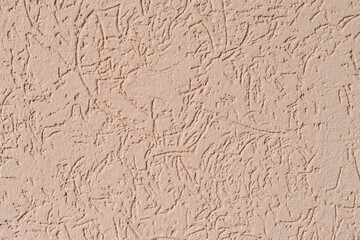 structure of wall covered with beige textured putty