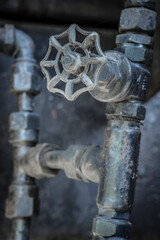 old water tap on a industrial machine