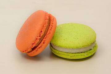 Closeup of colorful orange and green macaroons