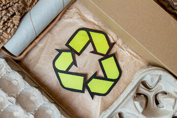 Paper, cardboard, cartoon used waste with a recycling sign