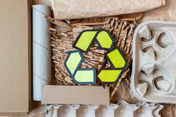 Paper, cardboard, cartoon used waste with a recycling sign