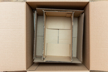 Carton, cardboard packages inside a paper box