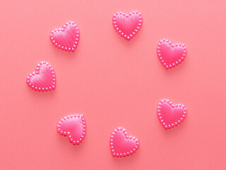 Pink hearts on a pink background.