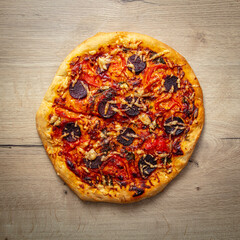 Pizza with tomatoes and sausage