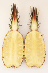 Pineapple (Ananas comosus), cut-open  on  white background, Sao Paulo, Brazil