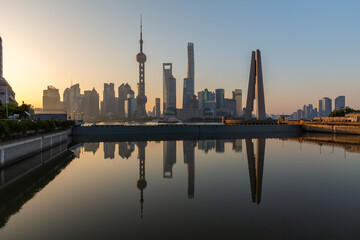 Shanghai Pudong Skyline at dusk - with water reflections of the skyscrapers.