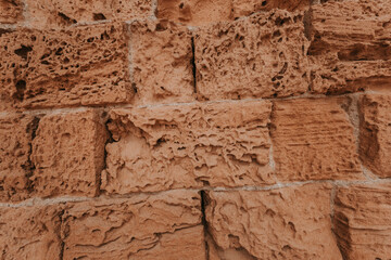 Stone wall texture/background,historical old ancient stone,preserved to our time, stones are laid evenly, solid construction has been standing for many centuries,ancient buildings,buildings and ruins