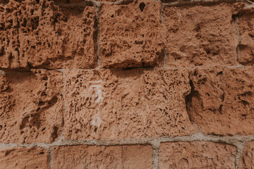 Stone wall texture/background,historical old ancient stone,preserved to our time, stones are laid evenly, solid construction has been standing for many centuries,ancient buildings,buildings and ruins