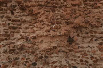 Stone wall texture/background,historical old ancient stone,preserved to our time, stones are laid evenly, solid construction has been standing for many centuries,ancient buildings,buildings and ruins