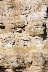 Rock surface pattern in nature. Limestone steep slope background. Nowiny quarry. Poland, Europe.