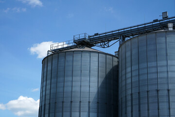 An old rusted silo photographed in a port area in summer