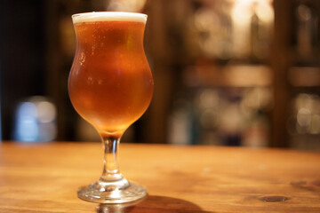 cup of beer on wooden table