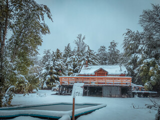 House in the winter under the snow