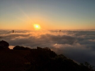 sunrise over the city and the clounds golden gate bridge