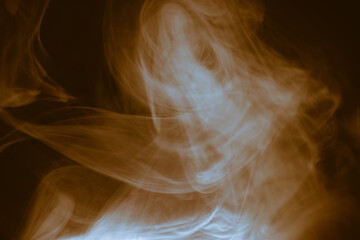 Clouds of colored flowing smoke on a dark background.
