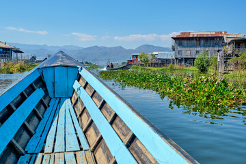 Wooden floating houses on Inle Lake in Shan, Myanmar, view from boat