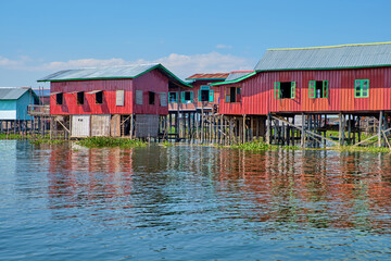 Wooden floating houses on Inle Lake in Shan, Myanmar, view from boat