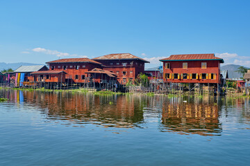 Wooden floating houses on Inle Lake in Shan, Myanmar, view from boat