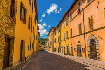 A deserted street at siesta time in the city of Gubbio, Italy in summer