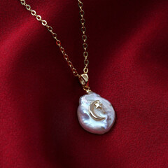Golden crescent moon baroque pearl pendant with gold chain