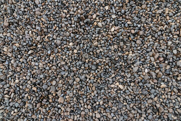 Top view of the pebbles stone on the floor. beautiful small stone on the beach background texture.
