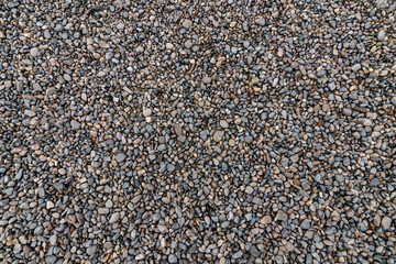 Top view of the pebbles stone on the floor. beautiful small stone on the beach background texture.