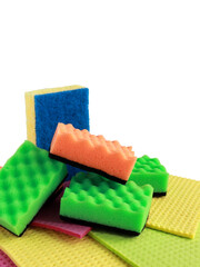 cleaning sponges of different bright colors for washing dishes and cleaning the room and disinfection on a white background, the concept of cleaning, surface disinfection. cleaning services. isolate