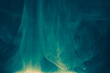 Clouds of colored flowing smoke on a dark background.