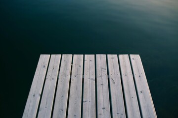 Wooden decking over calm water